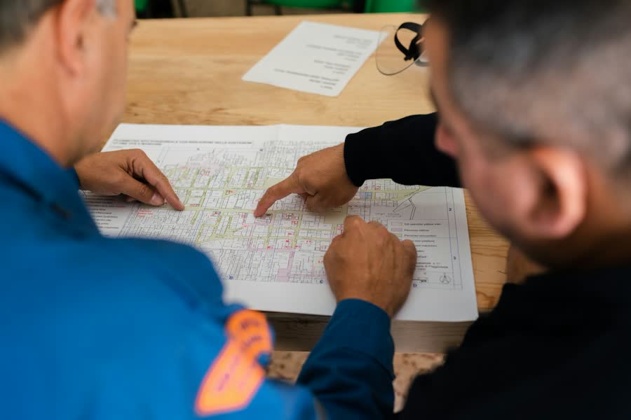 Two engineers reviewing an electrical drawing